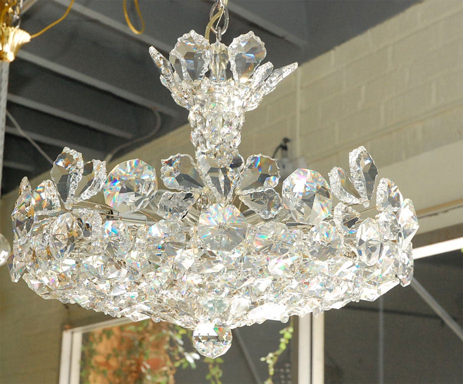 A beautiful, smaller Schonbek crystal chandelier, restored and rewired.