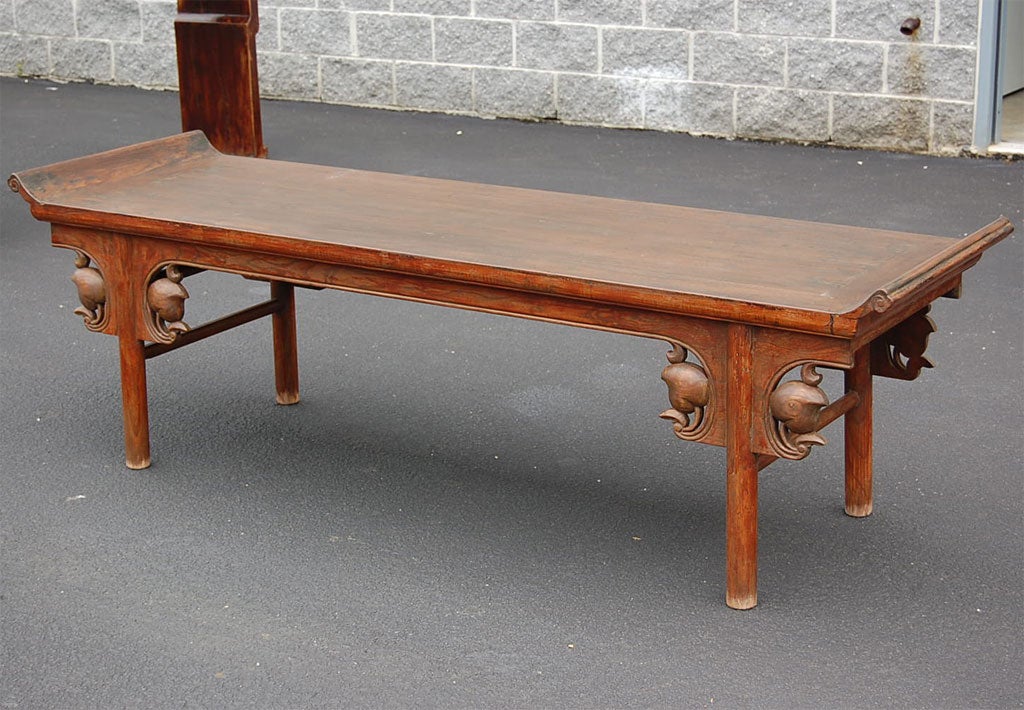 Early 19th century Qing dynasty Shanxi pomegranate carved scrolled bench.