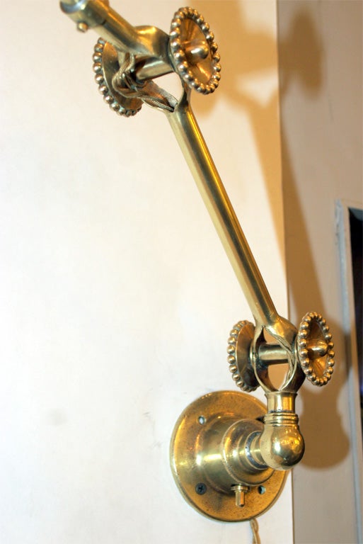 A Pair of French Art Deco Articulated  brass Wall Sconces 1
