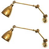 A Pair of French Art Deco Articulated  brass Wall Sconces