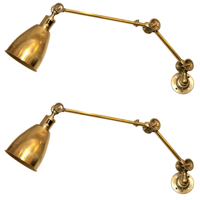 A Pair of French Art Deco Articulated  brass Wall Sconces