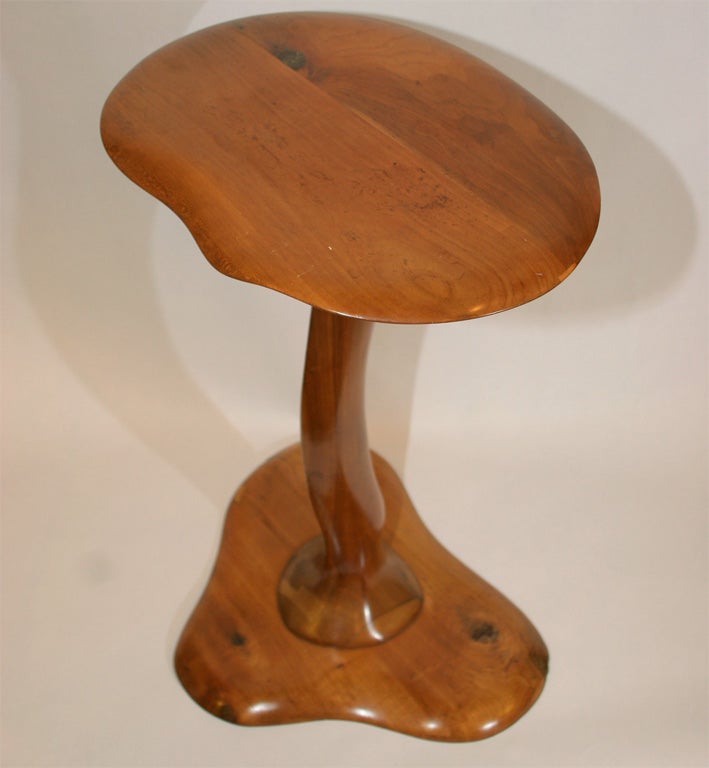 A surrealist handcrafted wood table.