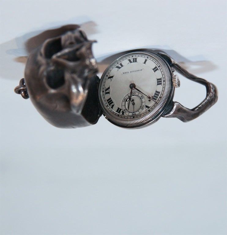 Silver Figural Pocket Watch in shape of human skull with movable jawbone which reveals watch when opened.  Marked 
