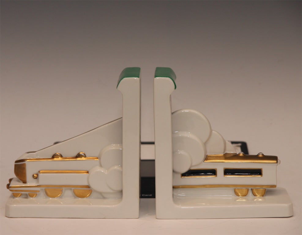 Extremely rare Modernist Figural Train Bookends depicting a steam locomotive passing through a tunnel.  Signed on bottom Robj, Paris, Made in France.