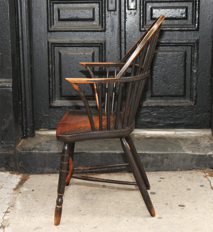 Rare and fine English late 18th/early 19th Century hoop back windsor armchair, Made by Gillows of Lancaster, retaining much of its original painted decoration including black ground, pin striping, ringing and squiggles, the saddle seat appears to be