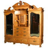 A stunning English Antique satinwood armoire.