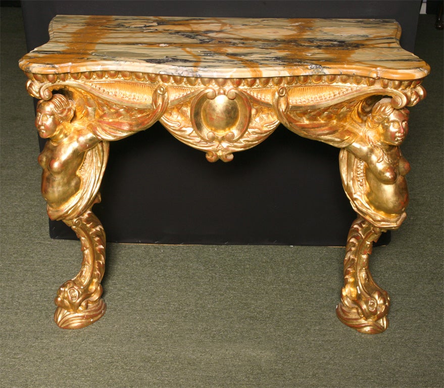 A pair of giltwood console tables.