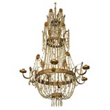 8035  A GILDED TOLE AND CRYSTAL CHANDELIER