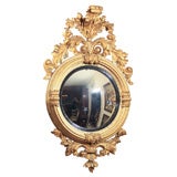 Antique Bull's eye mirror with elaborate gilt frame