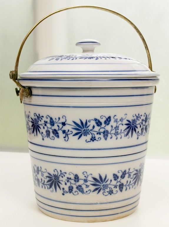 Oversized porcelain bucket with brass bail and screws that would fit perfectly in a country kitchen filled with fruit or onions or greens. The lid is shaped to allow room for the brass handle, for a nice tight fit. The Delft-style blue and white