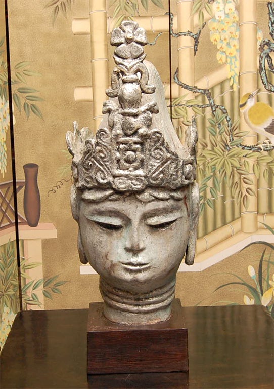 Late 19th century Thai silver leafed Buddha on pedestal.