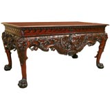 GEORGE II STYLE CARVED MAHOGANY CONSOLE WITH WINGED CHERUBS AN