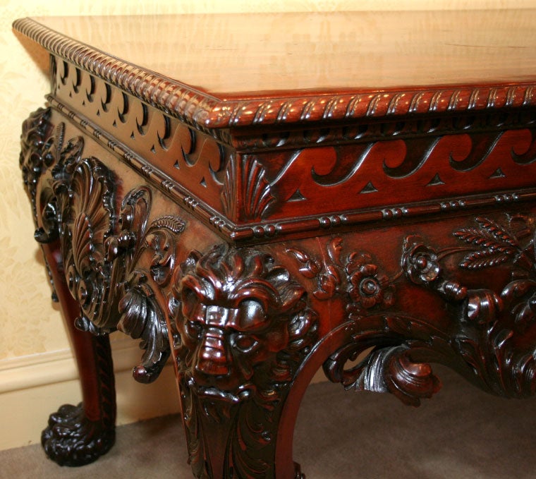19th Century GEORGE II STYLE CARVED MAHOGANY CONSOLE WITH WINGED CHERUBS AN