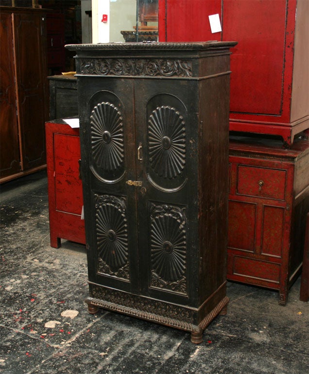 Carved Teak Armoire with Floral Detailing and Hidden Compartinment on Top.