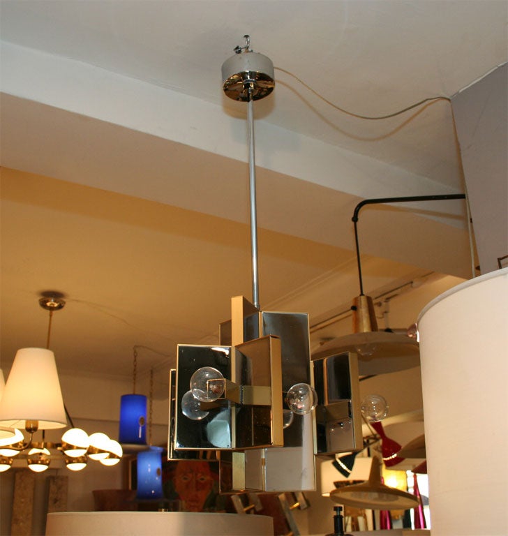 A modernist hanging fixture by Sciolari. Two available.