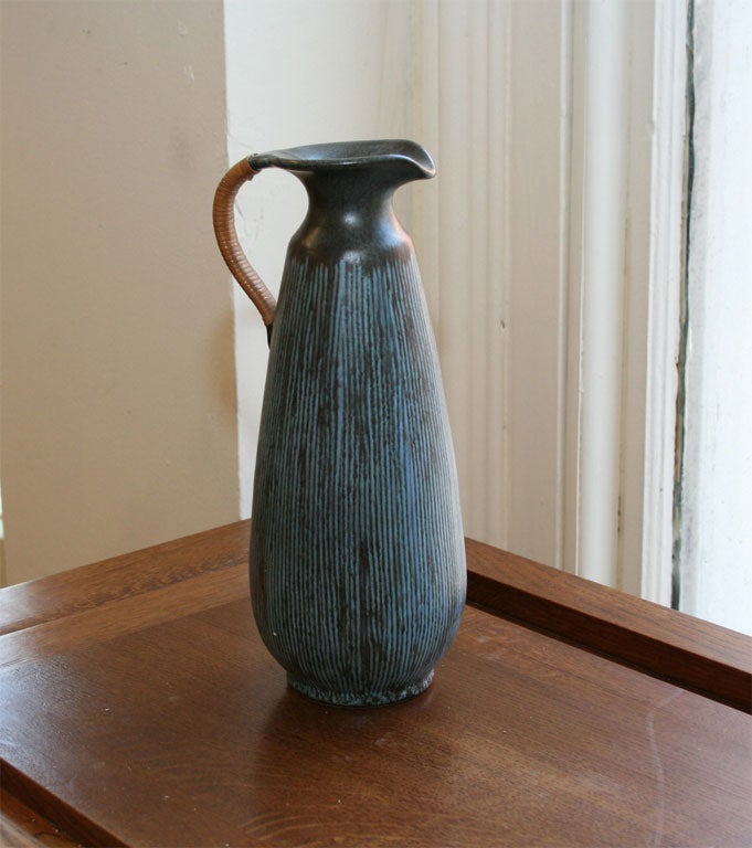 Ceramic Pitcher with straw handle.<br />
In the shades of Dark Navy Blue & Light blue.<br />
Stamped: LOVEMOSE, DENMARK