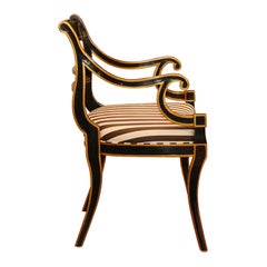 Ebonized Regency armchair with gilt details by Dorothy Draper