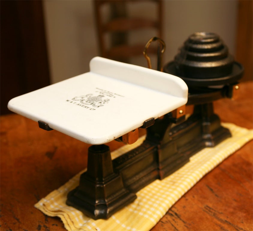 this scale, made by the famous maker W & T Avery, was originally used as a dairy scales The porcelain tray is stunning and the weights are original to the piece. This would look terrific with a plant on the plate or a center piece for a buffet or