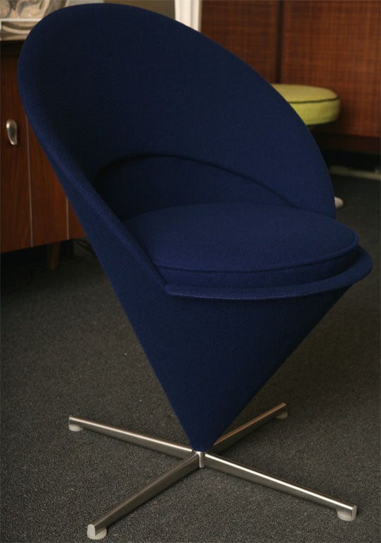 SOLD OCTOBER 2009          Verner Panton's iconic Cone Chair, designed in 1958.       Originally designed for a restaurant, the chair swivels and is quite comfortable.  Upholstered in Kvadrat Tonus wool weave in dark blue.  This chair is from 2000,