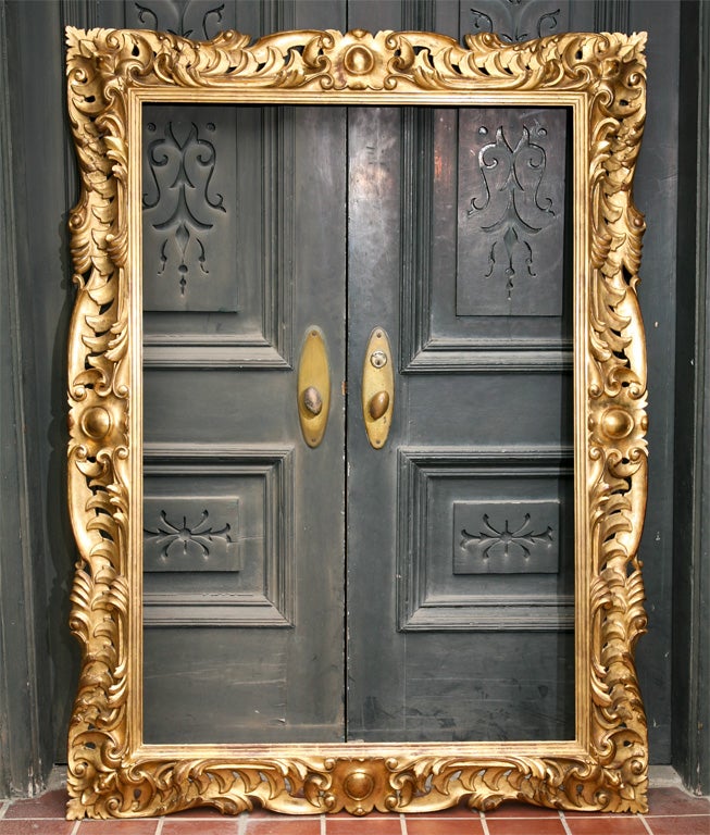 This very fine baroque frame is of great quality with fine gilding in very good condition. The carving is cut through in a number of places creating  positive and negative spaces on the wall.  This frame would make a beautiful mirror 