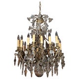 Antique French crystal and bronze 18-light chandelier.