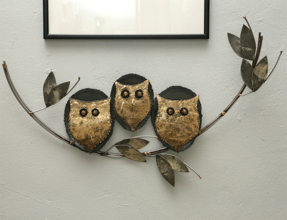 We love the look and the materials of this vintage metal wall sculpture by Curtis Jere. Three adorable brass owls are pearched on an oxidzed iron branch...just waiting for you to give them a new home! Signed.
