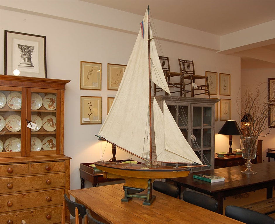 A handsome, tall English pond yacht from 1900 restored and renovated with canvas sails and brass trim resting on a later base.<br />
CONTACT US FOR<br />
SPECIAL DEALER PRICE.