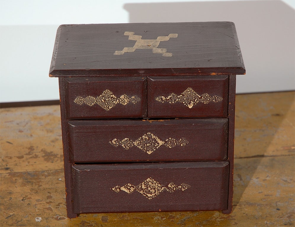 19th century miniature chest of drawers in original paint.