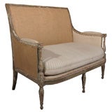 a petite Louis XVI style sofa