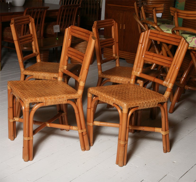 Set of 4 rattan dining chairs with caning on seats... fine & rare form.  ***Contact/Shipping Information: AOL (American Online) users may experience difficulties sending emails to us or receiving emails from us. If you have made an inquiry to us and