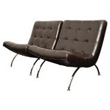 Tufted leather lounge chairs by Milo Baughman