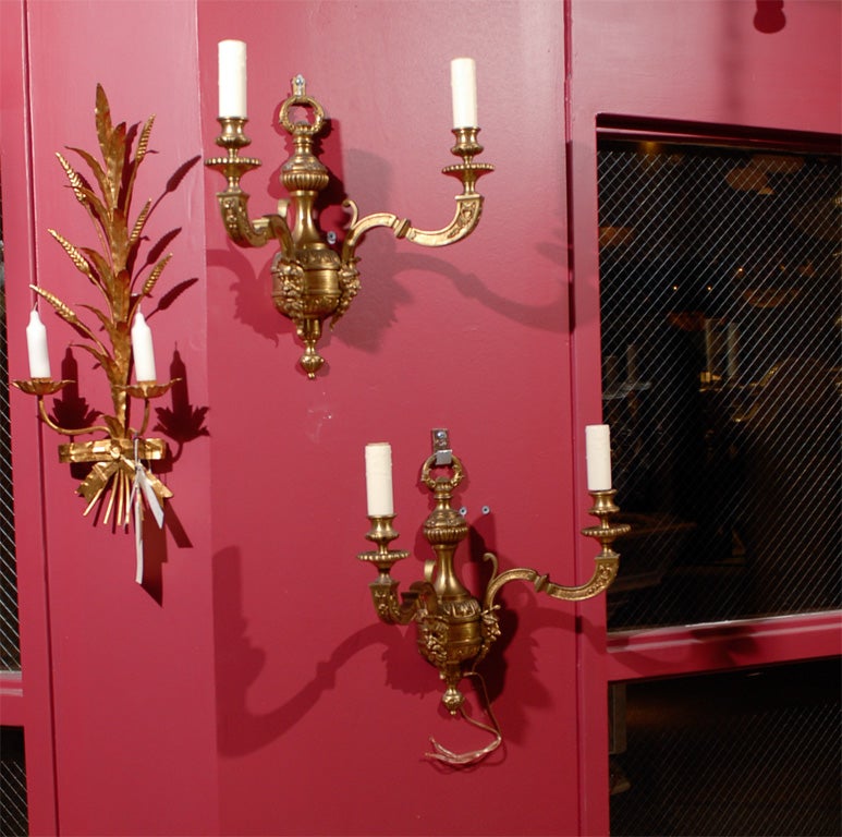A fine pair of gilt bronze wall sconces with mythological figures.