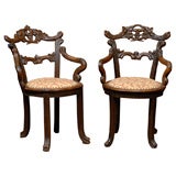 Pair of  Walnut Black Forest Arm Chairs, ca. 1890.