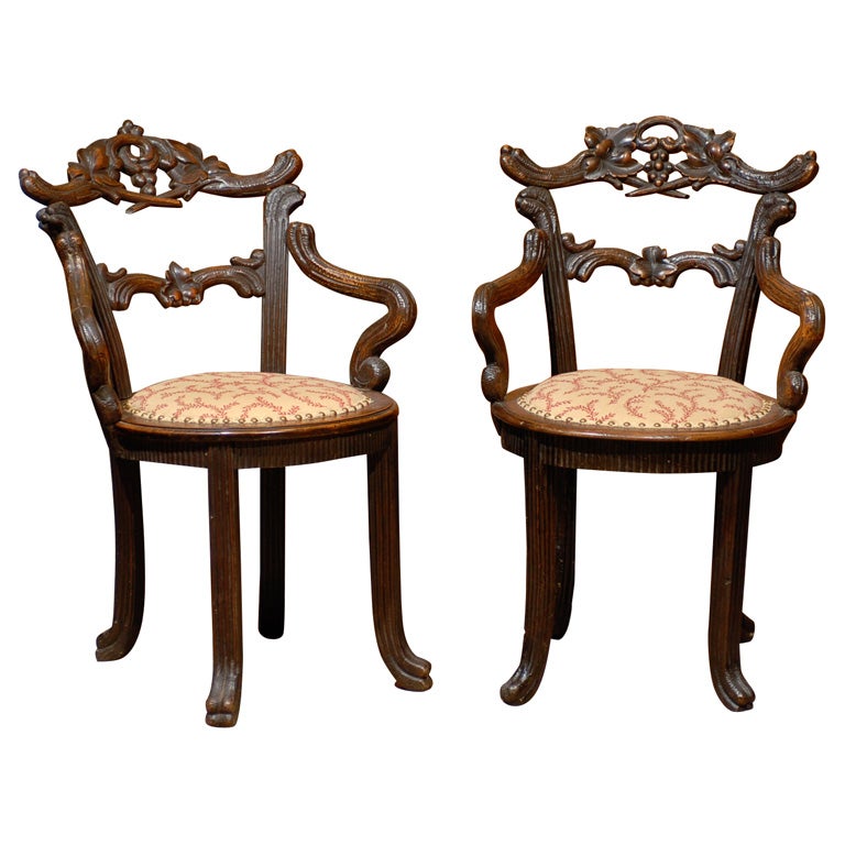 Pair of  Walnut Black Forest Arm Chairs, ca. 1890.
