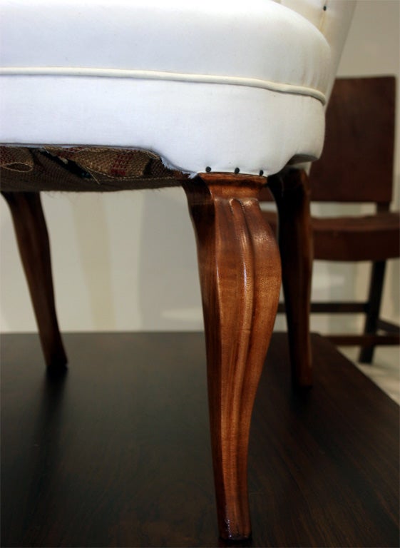 Early and Rare Wingback Chair originally designed by Frits Henningsen in 1935.  Features elegant beechwood legs, a high back and dainty silhouette.  Upholstered in muslin fabric.