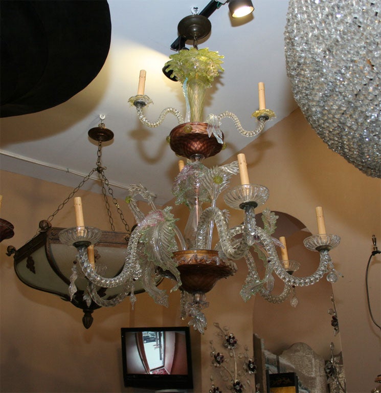 A, circa 1920 Venetian glass chandelier with two tiers foliage motif decorative elements.