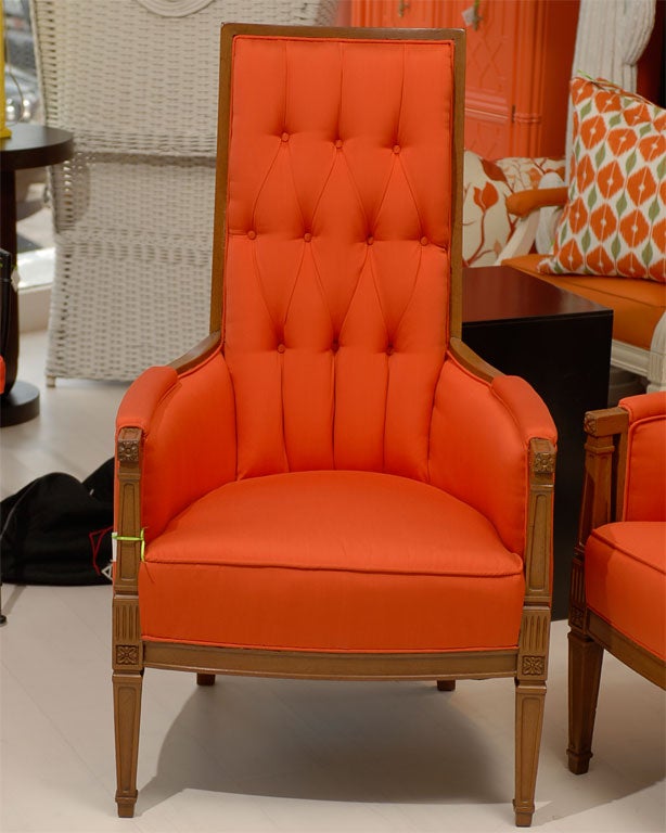 These are unique vintage chairs with an updated chic style.  They have the original wood finish with tufted diamond detail.  Newly upholstered in high-end red orange solid fabric.