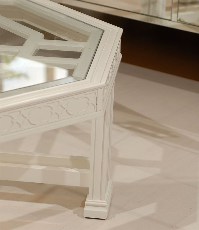 This is a unique vintage coffee table.  Inlay top design with detailed fretwork on side panels and legs.  Newly painted white semi gloss.