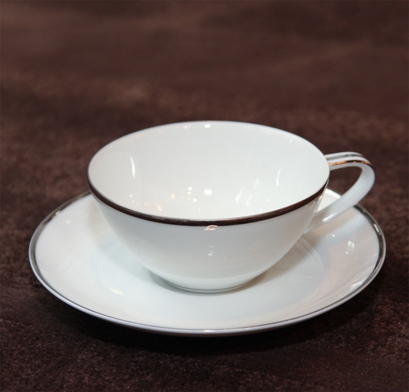 Complete service for 12 . Fine china trimmed in white gold.The set has dinner plates,salad plates,dessert plates,soup bowls and fruit/dessert bowls,cup and saucer,Sugar bowl,creamer,platter,gravy boat and serving bowl.The set is a great modernist