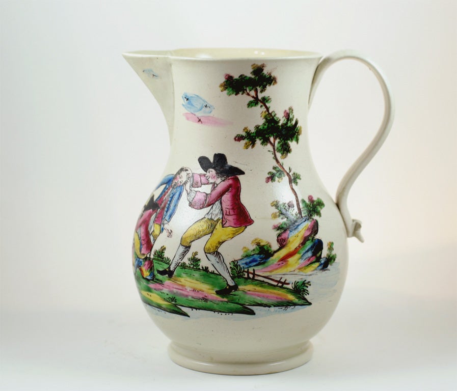 A rare English saltglazed stoneware pitcher decorated in enamel colors with a drinking scene