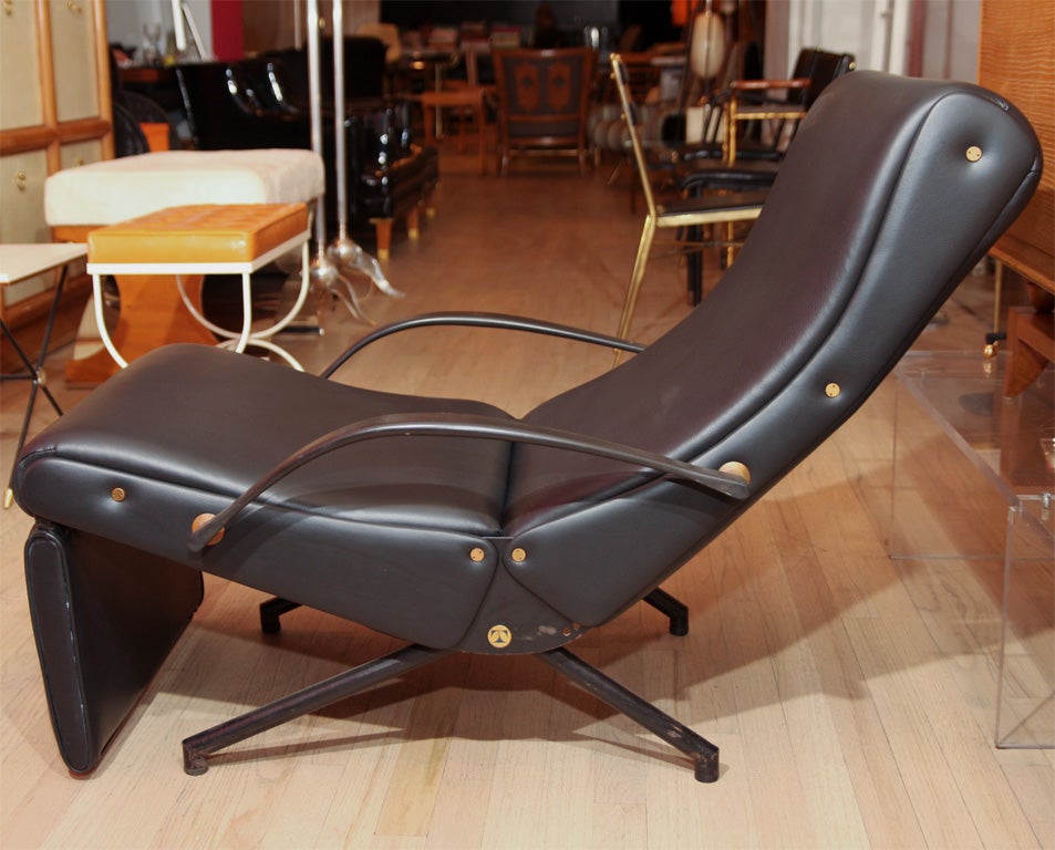 Vintage P40 lounge by Osvaldo Borsani, original version with solid back. Re-upholstered in black leather. Pair available.