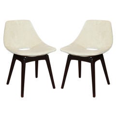 A pair of Pierre Guariche "Tonneau" chairs