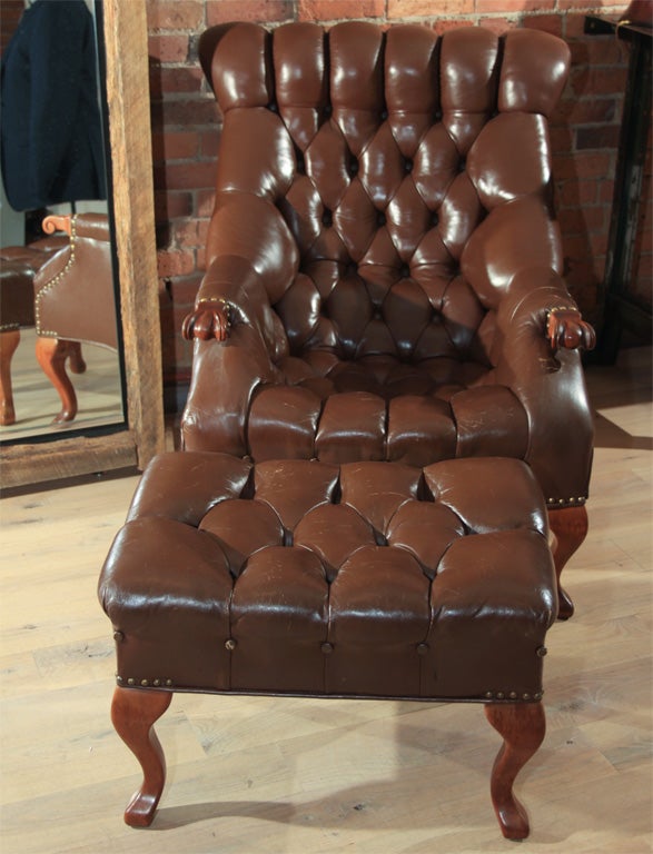 Chocolate brown tufted chair and ottoman. Perfect to lounge in and smoke a pipe and read the NY Times.