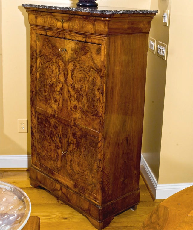 Louis-Philippe Secretaire Abattant in a burl wanut veneer with St Anne bevelled marble top, interior outfitted with drawers, secret compartments and veneered in exotic wood.