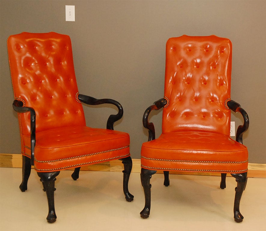 Pair of Kittinger arm chairs in orange leather.