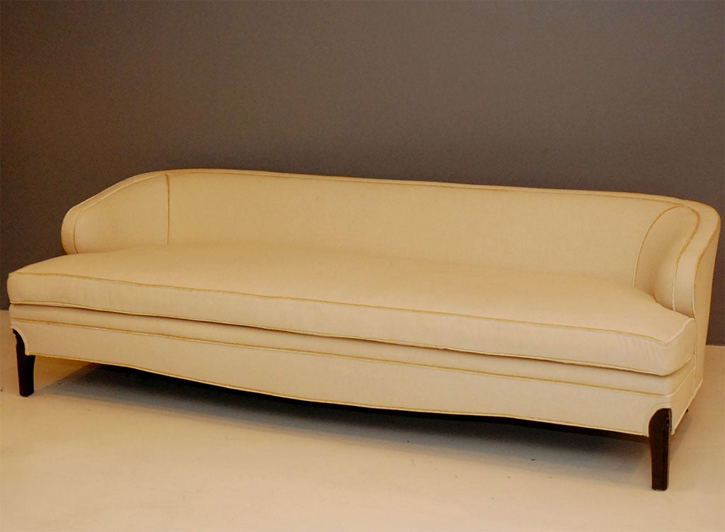 Rolled-arm sofa with carved oak base in a dark walnut stain.  Available to order for $2950 COM.  13 yards required.