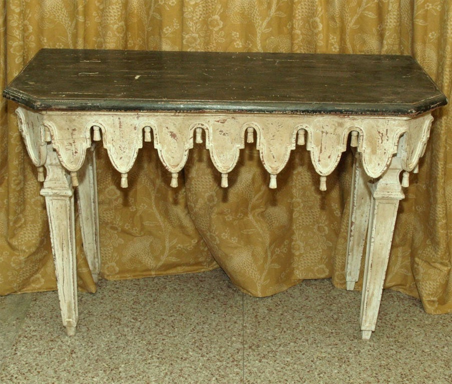 A pair of carved and painted Venetian consoles.