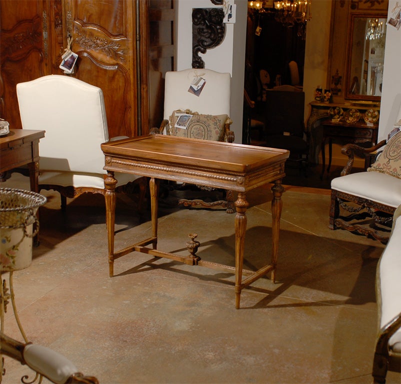 Swedish carved side table with stretcher and tray top, circa 1890.