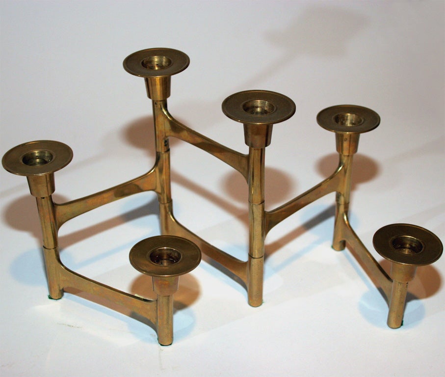 Two jointed brass candelabras, with six holders and four holders. The middle pair in the main image is no longer available.<br />
The jointed candlabras measure 7
