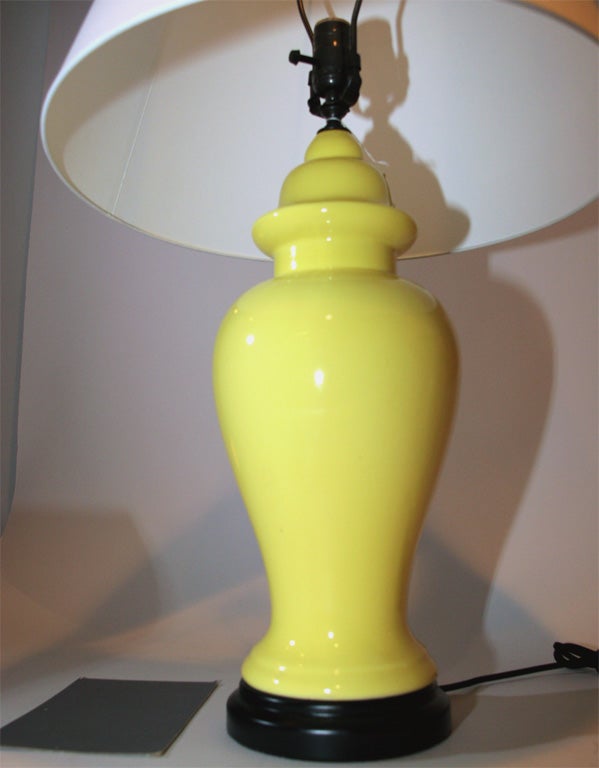 A pair of  yellow glazed ceramic table lamps. The lamps measure 22